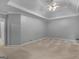 Generous main bedroom with tray ceiling, carpet flooring, and neutral walls at 1300 Lakehaven Pkwy, Mcdonough, GA 30253