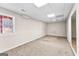 Finished basement area with carpeted flooring, natural light, and ample space for various activities at 510 Virginia Highlands, Fayetteville, GA 30215