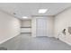 Unfinished basement area with tiled floor and built-in white storage cabinets for easy organization at 510 Virginia Highlands, Fayetteville, GA 30215