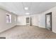 Finished basement featuring carpeted floors, an open layout, and multiple doors to other areas at 510 Virginia Highlands, Fayetteville, GA 30215