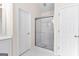 Bathroom with a glass shower door, a white vanity and tile floors at 510 Virginia Highlands, Fayetteville, GA 30215