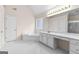 Bright bathroom featuring tile flooring, a soaking tub, and a vanity with a make-up counter at 510 Virginia Highlands, Fayetteville, GA 30215