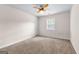 This bedroom has carpet, a ceiling fan, a window, and a closet at 510 Virginia Highlands, Fayetteville, GA 30215