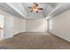 Spacious carpeted bedroom featuring a trey ceiling with a ceiling fan and neutral paint color at 510 Virginia Highlands, Fayetteville, GA 30215