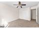 Bedroom featuring carpet, a ceiling fan, a closet and access to another room at 510 Virginia Highlands, Fayetteville, GA 30215