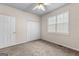 Bedroom featuring neutral carpet, a ceiling fan, a window, and closet at 510 Virginia Highlands, Fayetteville, GA 30215