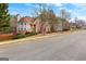 Traditional brick home with a bay window and manicured landscaping in a suburban neighborhood at 510 Virginia Highlands, Fayetteville, GA 30215