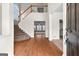 Open foyer featuring hardwood floors, staircase, and views into the living spaces at 510 Virginia Highlands, Fayetteville, GA 30215