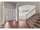 Inviting foyer with hardwood floors and view to staircase and bright sitting area at 510 Virginia Highlands, Fayetteville, GA 30215