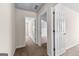Hallway with carpet that opens to two rooms with white doors at 510 Virginia Highlands, Fayetteville, GA 30215