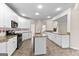 Bright kitchen boasts stainless appliances, granite countertops, tile backsplash, and center island at 510 Virginia Highlands, Fayetteville, GA 30215