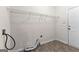 Unfinished laundry room with white door, shelving, and tile floor at 510 Virginia Highlands, Fayetteville, GA 30215