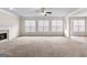 Expansive living room with fireplace, ceiling fan, and ample natural light at 510 Virginia Highlands, Fayetteville, GA 30215
