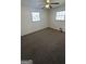 Comfortable bedroom with wall-to-wall carpet, natural light, and ceiling fan at 220 Cabriolet Trl, Mcdonough, GA 30253