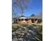 Charming brick ranch-style home with mature trees and a long driveway at 220 Cabriolet Trl, Mcdonough, GA 30253
