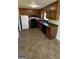 Functional kitchen with ample cabinet space, black appliances, and a double basin sink at 220 Cabriolet Trl, Mcdonough, GA 30253