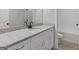 Bathroom features granite counters, white cabinets and a tub and toilet at 4139 Alayna Lee Cir, Mcdonough, GA 30252