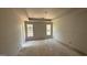 Bright bedroom with two windows, recessed lighting and a tray ceiling waiting for your personal touch at 4139 Alayna Lee Cir, Mcdonough, GA 30252