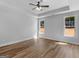 Bright bedroom features a ceiling fan, wood-look floors and two large windows at 4139 Alayna Lee Cir, Mcdonough, GA 30252