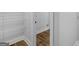 Walk-in closet offering generous storage space with wire shelving and wood-look flooring at 4139 Alayna Lee Cir, Mcdonough, GA 30252