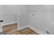 Walk-in closet features wire shelving, wood-look floors and white trim at 4139 Alayna Lee Cir, Mcdonough, GA 30252