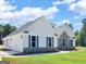 Beautiful home exterior showing stone and siding with a well manicured lawn at 4139 Alayna Lee Cir, Mcdonough, GA 30252