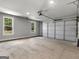 The garage offers ample space for vehicles and storage with natural light at 4139 Alayna Lee Cir, Mcdonough, GA 30252