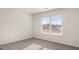 Well-lit bedroom with a large window offering a view of the outdoors at 1712 Goodwin Dr, Hampton, GA 30228