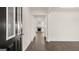 Bright foyer with wood-look flooring leading to a living area with a fireplace at 1712 Goodwin Dr, Hampton, GA 30228