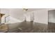 Large living room boasts hardwood floors and easy access to different rooms at 1712 Goodwin Dr, Hampton, GA 30228
