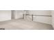 Large loft with plush carpeting and a decorative white wood railing at 1712 Goodwin Dr, Hampton, GA 30228