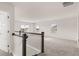 The loft area features plush carpeting, white walls, and lots of natural light at 1712 Goodwin Dr, Hampton, GA 30228