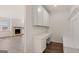 This office nook area has a built-in desk with drawers, cabinets, and bench at 1712 Goodwin Dr, Hampton, GA 30228