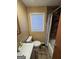 Cozy bathroom featuring a tub/shower combo, toilet and window at 452 Fedora Nw Way, Atlanta, GA 30331