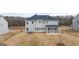 Exterior of newly built home featuring a spacious backyard and multi-level windows at 1708 Goodwin Dr, Hampton, GA 30228