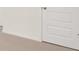 Interior of a home featuring a white painted door and neutral colored carpet at 1708 Goodwin Dr, Hampton, GA 30228