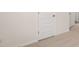 Hallway with neutral carpet and doors at 1708 Goodwin Dr, Hampton, GA 30228