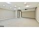 Spacious carpeted basement area with neutral walls, recessed lights, and white trim at 165 Standing Oak Pl, Fayetteville, GA 30214