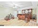Finished basement with a bar, barstools, and recessed lighting for entertaining at 165 Standing Oak Pl, Fayetteville, GA 30214