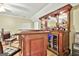 Finished basement bar with a bar, barstools, wine cooler and recessed lighting at 165 Standing Oak Pl, Fayetteville, GA 30214