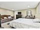 Basement bedroom with carpet, a sofa, dresser, and a queen-size bed at 165 Standing Oak Pl, Fayetteville, GA 30214