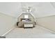 Spacious bedroom under vaulted ceilings, a ceiling fan, a large bed, and bench at 165 Standing Oak Pl, Fayetteville, GA 30214