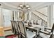 Large dining room featuring a beautiful chandelier and space for many guests at 165 Standing Oak Pl, Fayetteville, GA 30214
