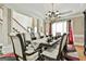The dining room is highlighted by a chandelier, large table, and elegant trim at 165 Standing Oak Pl, Fayetteville, GA 30214