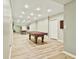 Finished basement with a pool table, recessed lighting and a large mirror at 165 Standing Oak Pl, Fayetteville, GA 30214