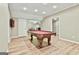 Finished basement game room features recessed lighting, a wood-look floor, and a pool table at 165 Standing Oak Pl, Fayetteville, GA 30214