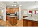 Well-appointed kitchen with granite countertops, wood cabinets, and modern appliances at 165 Standing Oak Pl, Fayetteville, GA 30214