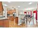 Open concept kitchen with wood cabinets, stainless steel appliances, and a breakfast bar at 165 Standing Oak Pl, Fayetteville, GA 30214