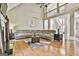 Spacious living room with a high ceiling, wooden floors, and comfortable oversized sectional sofa at 165 Standing Oak Pl, Fayetteville, GA 30214