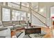 Relaxing living room with hardwood floors, a staircase, and plenty of natural light at 165 Standing Oak Pl, Fayetteville, GA 30214